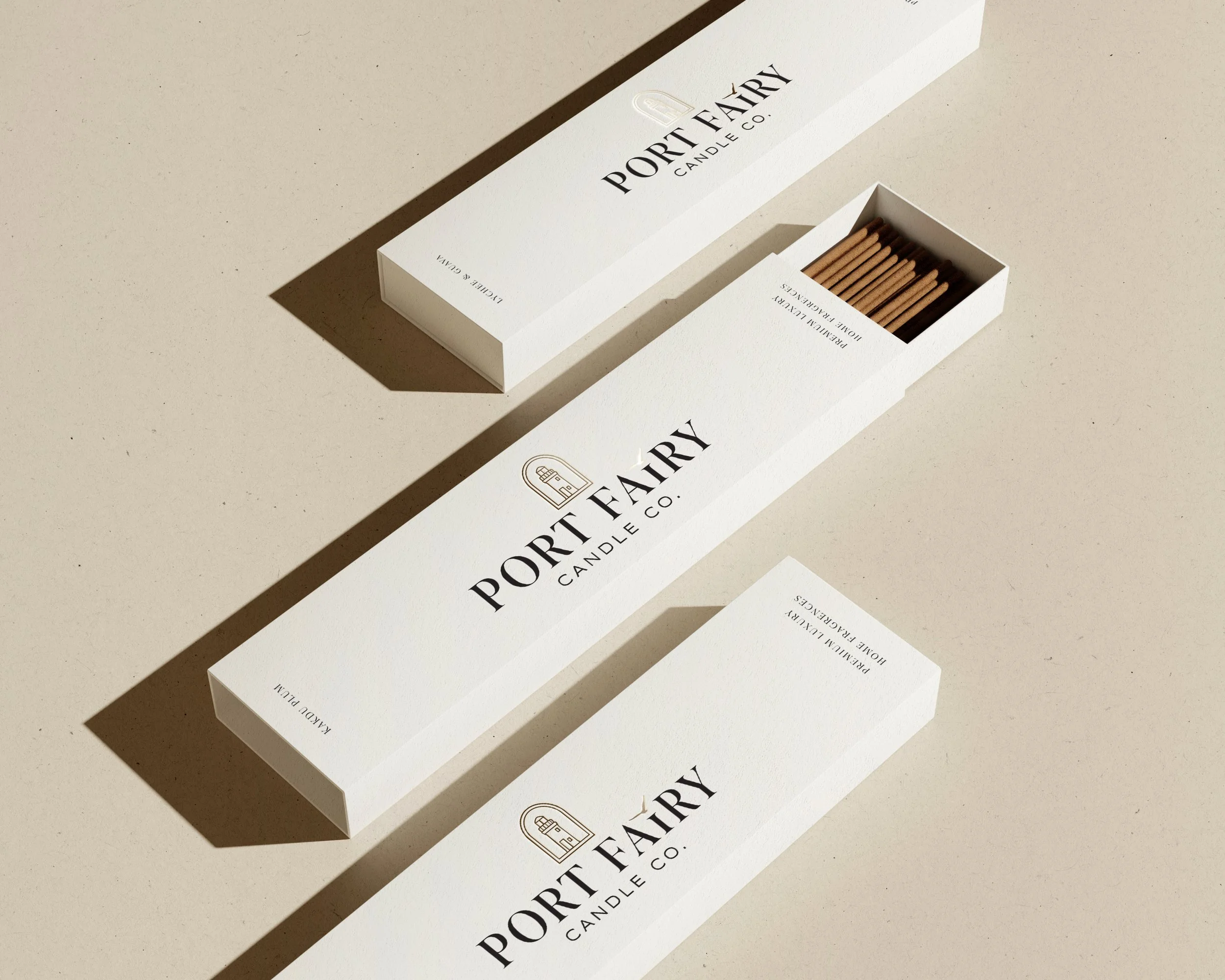 Port Fairy Candle Co. incense packaging mockup featuring minimal cream boxes with branded logo, incense sticks and soft natural product styling.