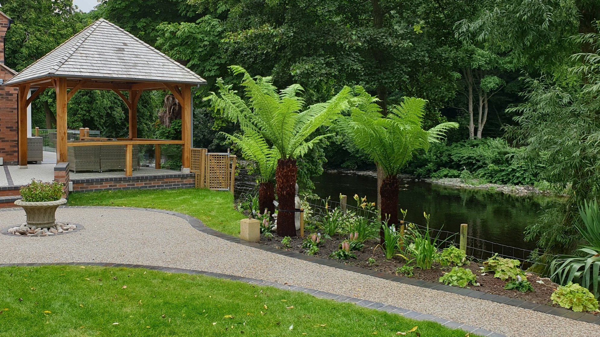 Slate roof gazebo and tree ferns, North Wales Garden Design Riverside