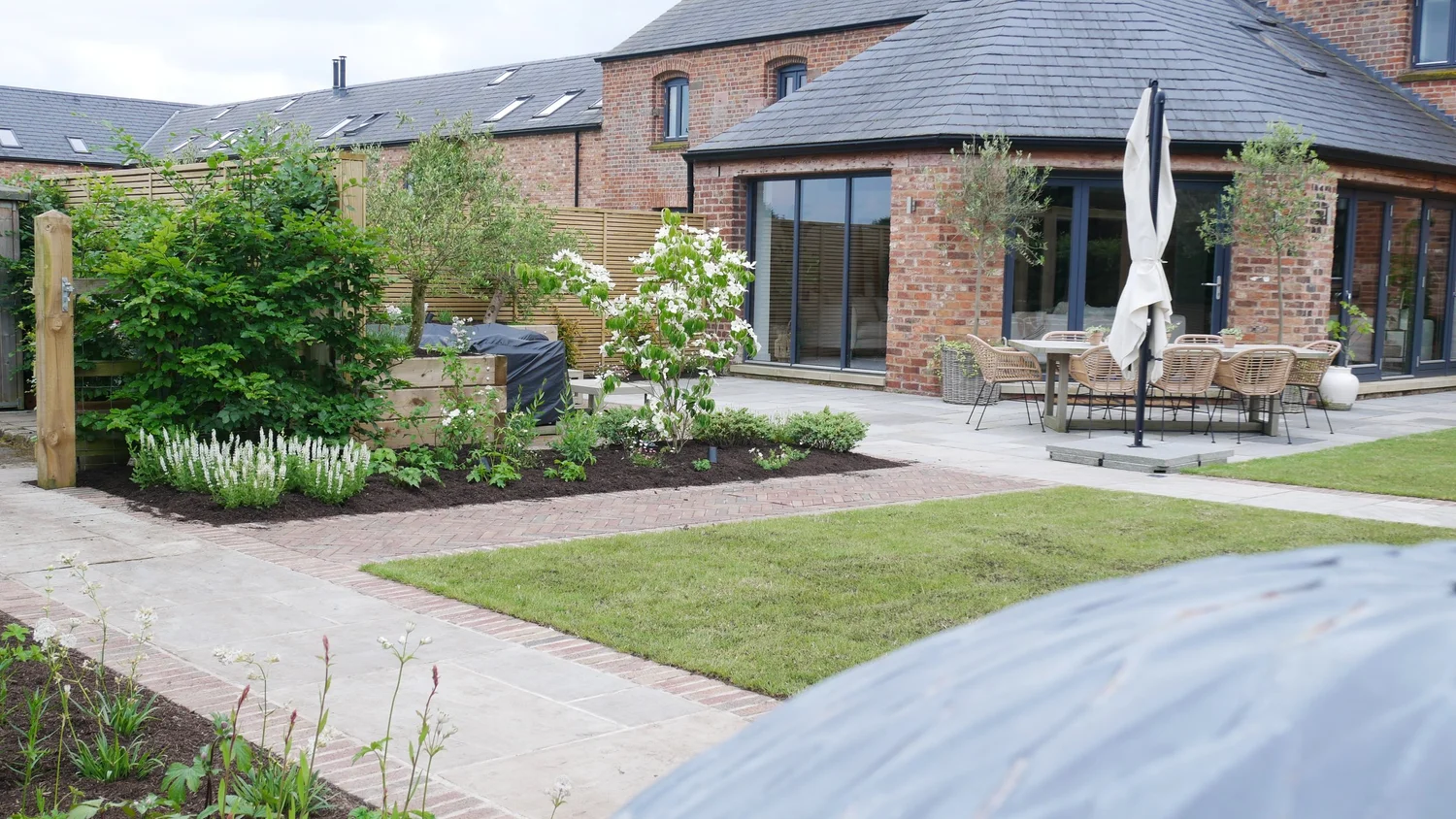 Pale layered planting at Belgrave Barn in Cheshire