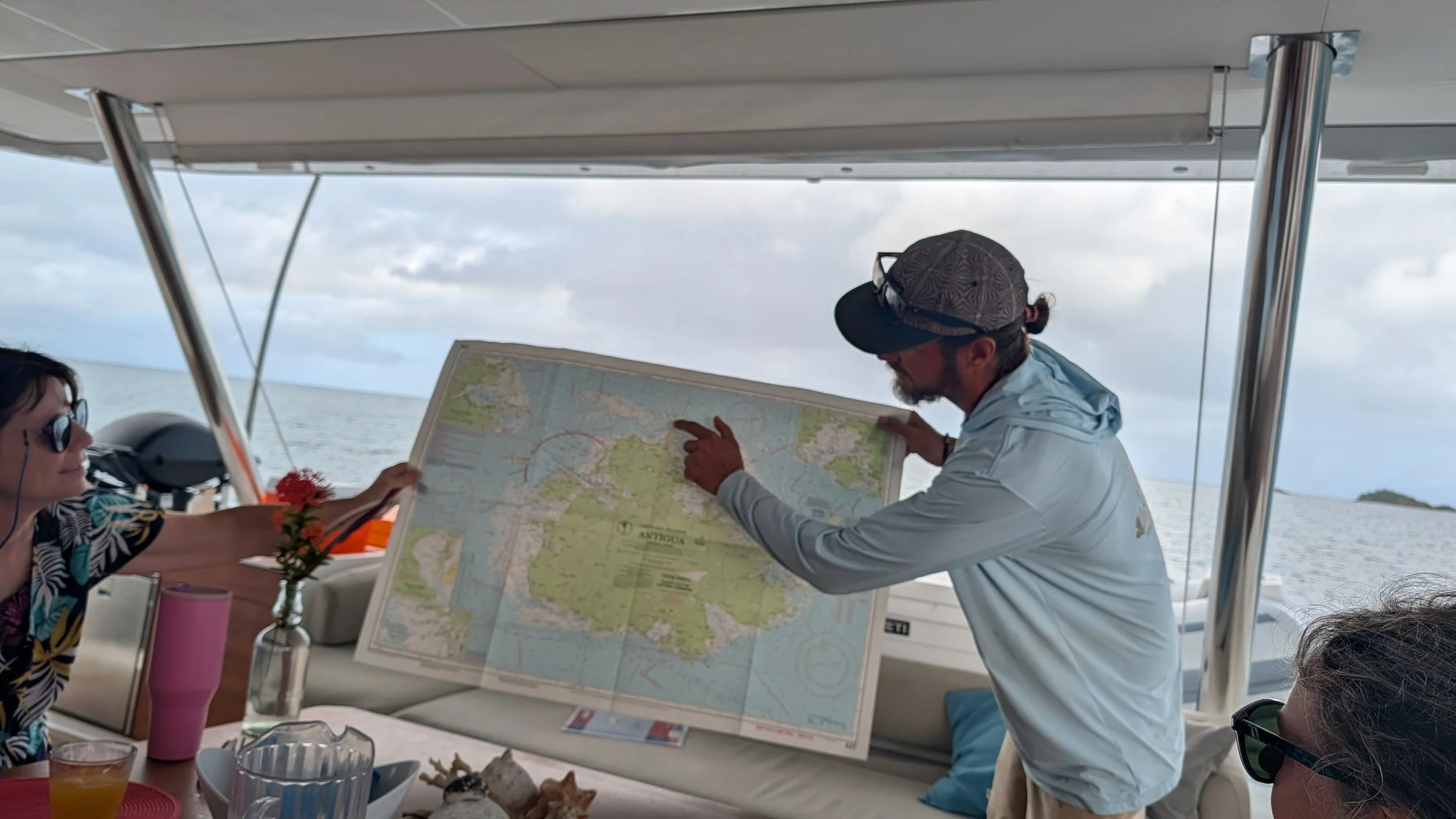 Captain Warren shows the map of Antigua