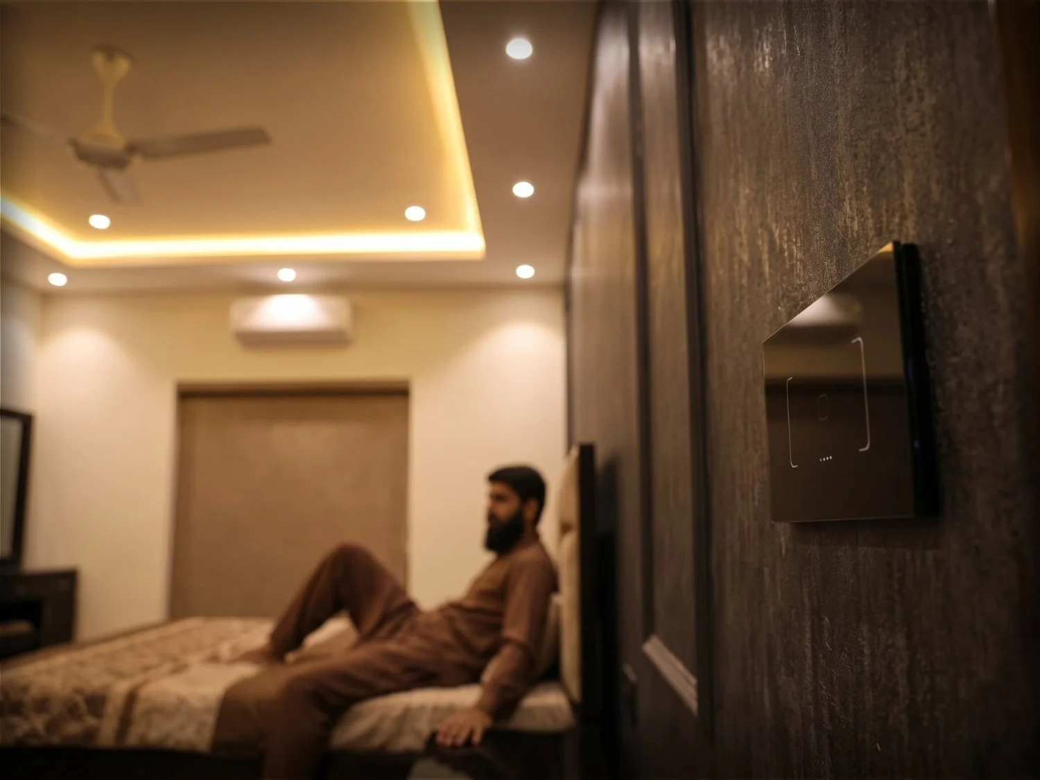 Modern smart Wi-Fi touch switches and ambient ceiling channel profile lighting installed in residential interior. By Rizwan Electrician Burewala