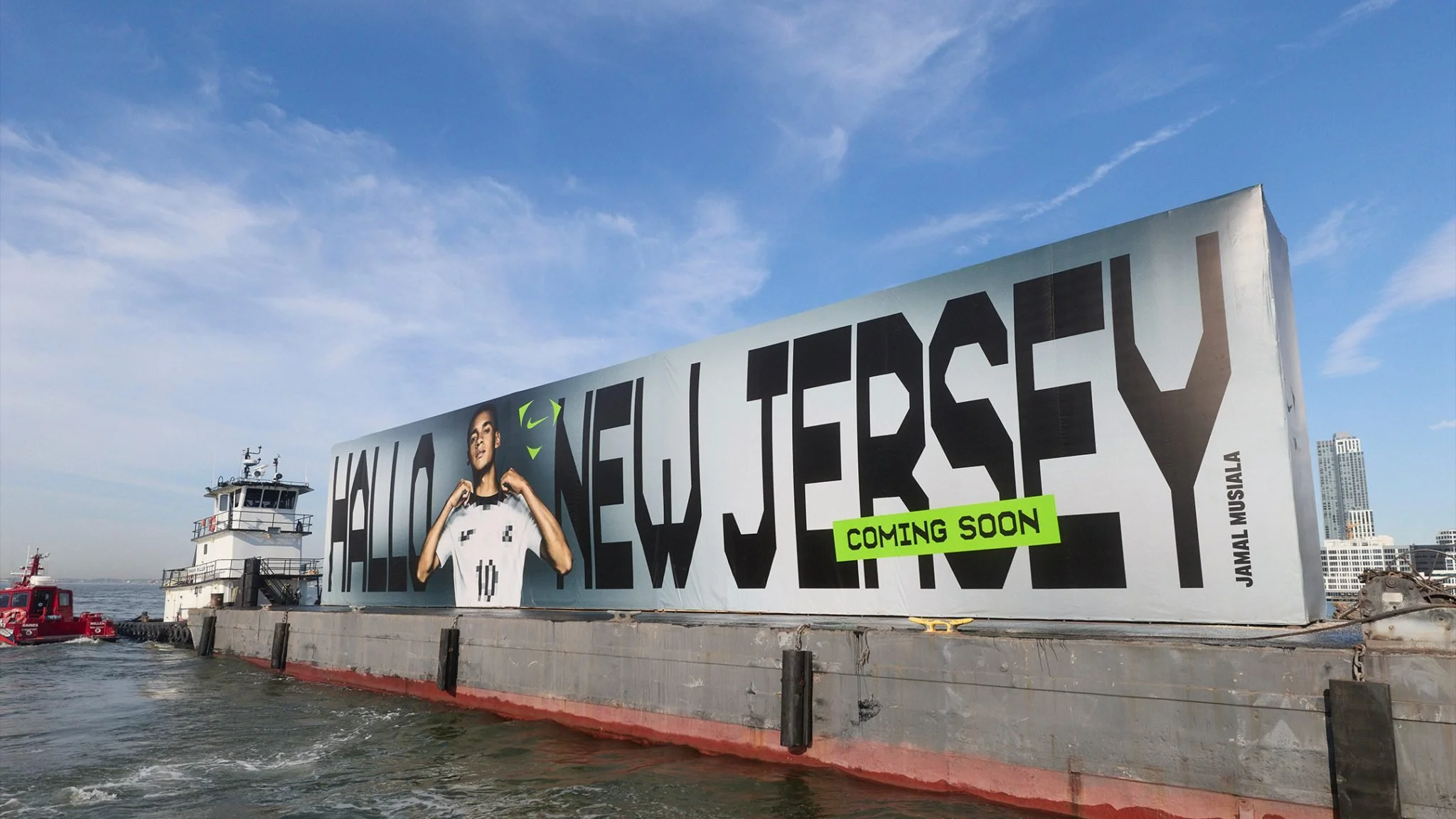 Close-up of the 'Hallo New Jersey' billboard with Jamal Musiala on a barge, Nike Football Jamal Musiala World Cup 2026