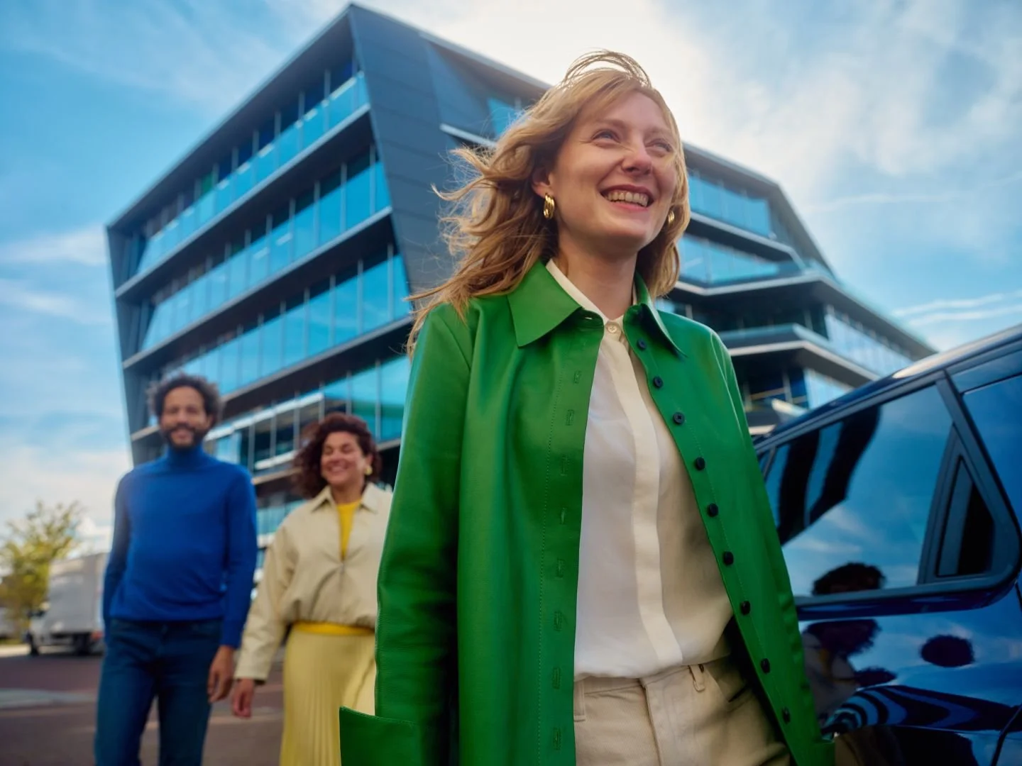 Three colleagues walking in a business district, Athlon Car Lease shoot in Amsterdam