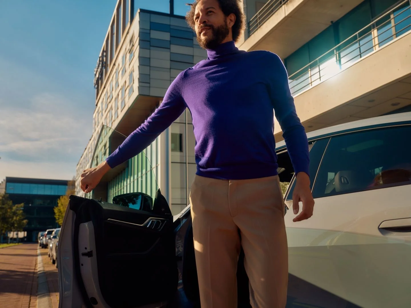 Man closing his car door in the city, Athlon Car Lease shoot in Amsterdam