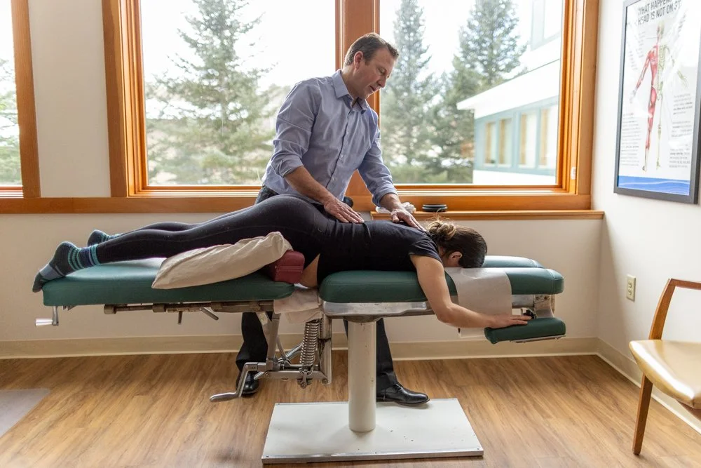 Dr. Knut performing a gentle chiropractic alignment on a pregnant patient