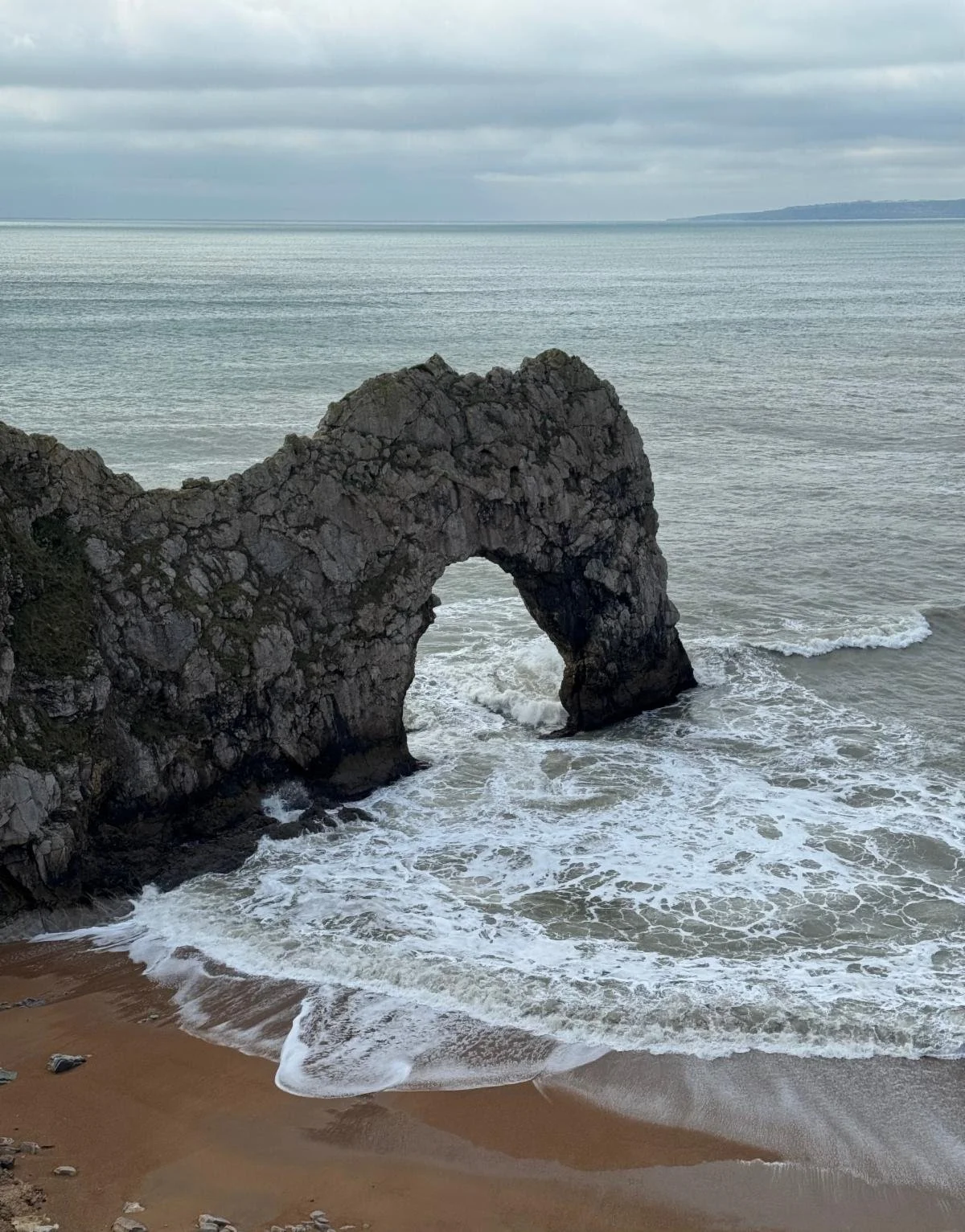 Durdle Door - a dramatic limestone arch carved by centuries of waves