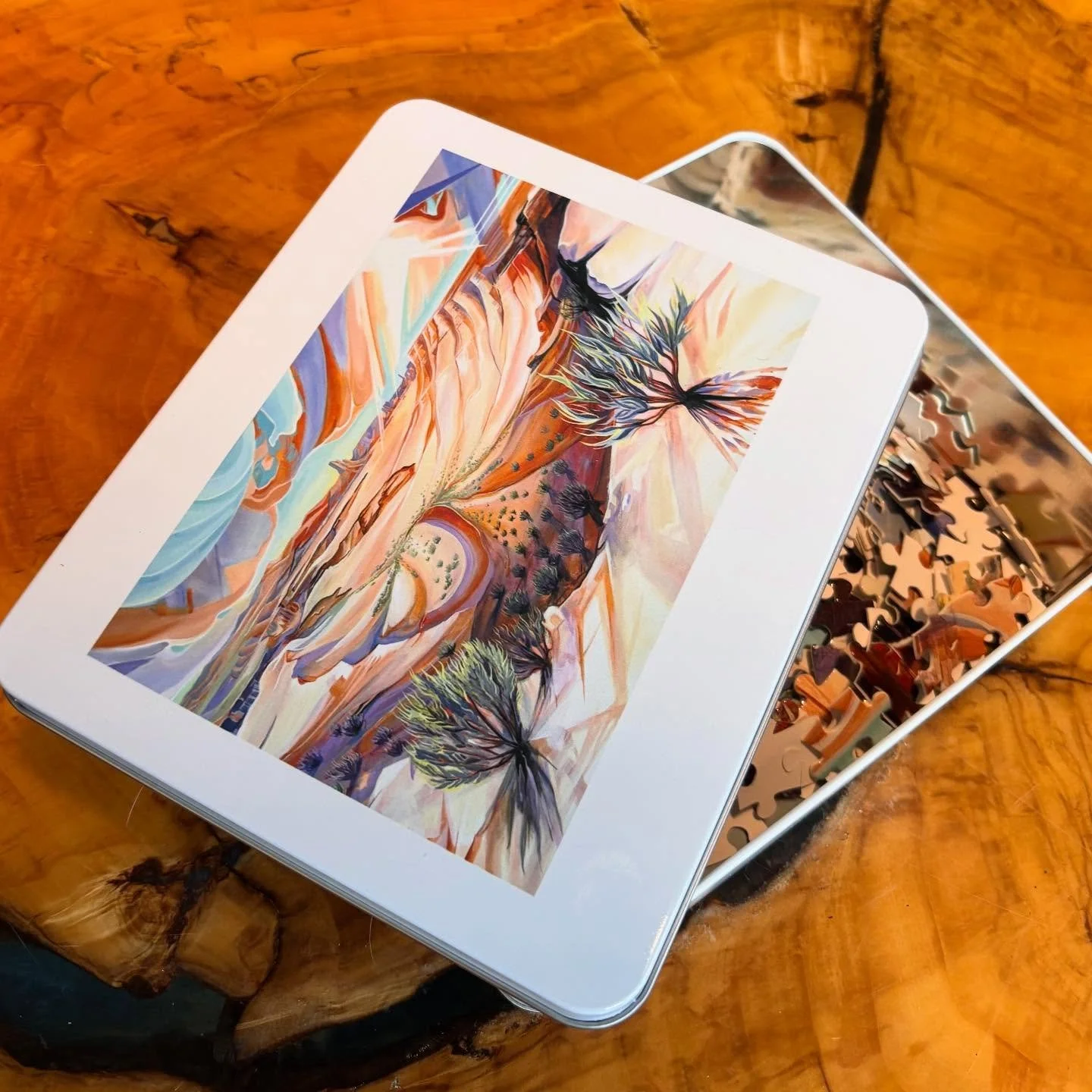 🚨New puzzles are up on my website! Bring the desert home with this premium puzzle featuring my original White Rim artwork, inspired by a bike trip through Canyonlands National Park.

Packaged in a durable, reusable metal tin with artwork printed on 