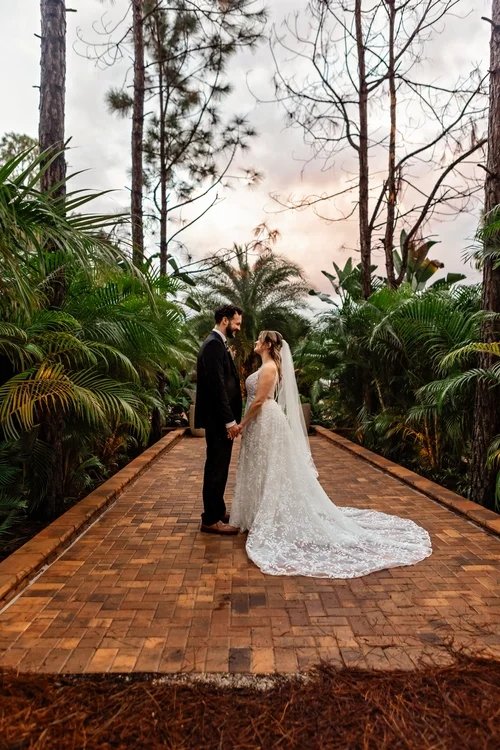 Couple in pine forest at dusk at outdoor wedding venue near Casselberry Florida at The Pinery