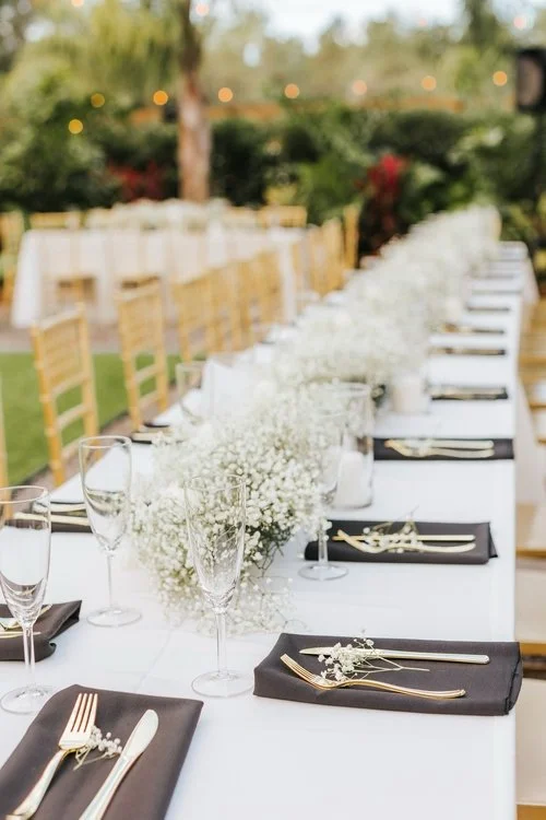 Long reception table with florals at outdoor wedding venue near Land O Lakes Florida