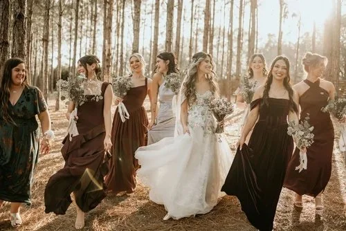 Bridal party walking through pine forest at outdoor wedding venue near St. Petersburg Florida