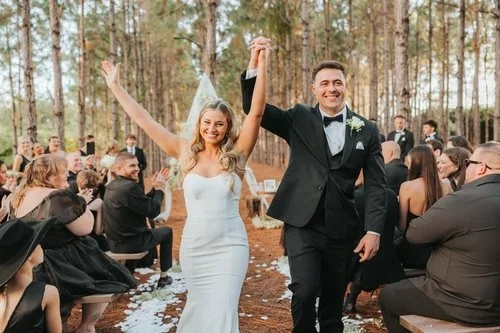 Couple celebrating at forest wedding ceremony near Melbourne Florida at The Pinery