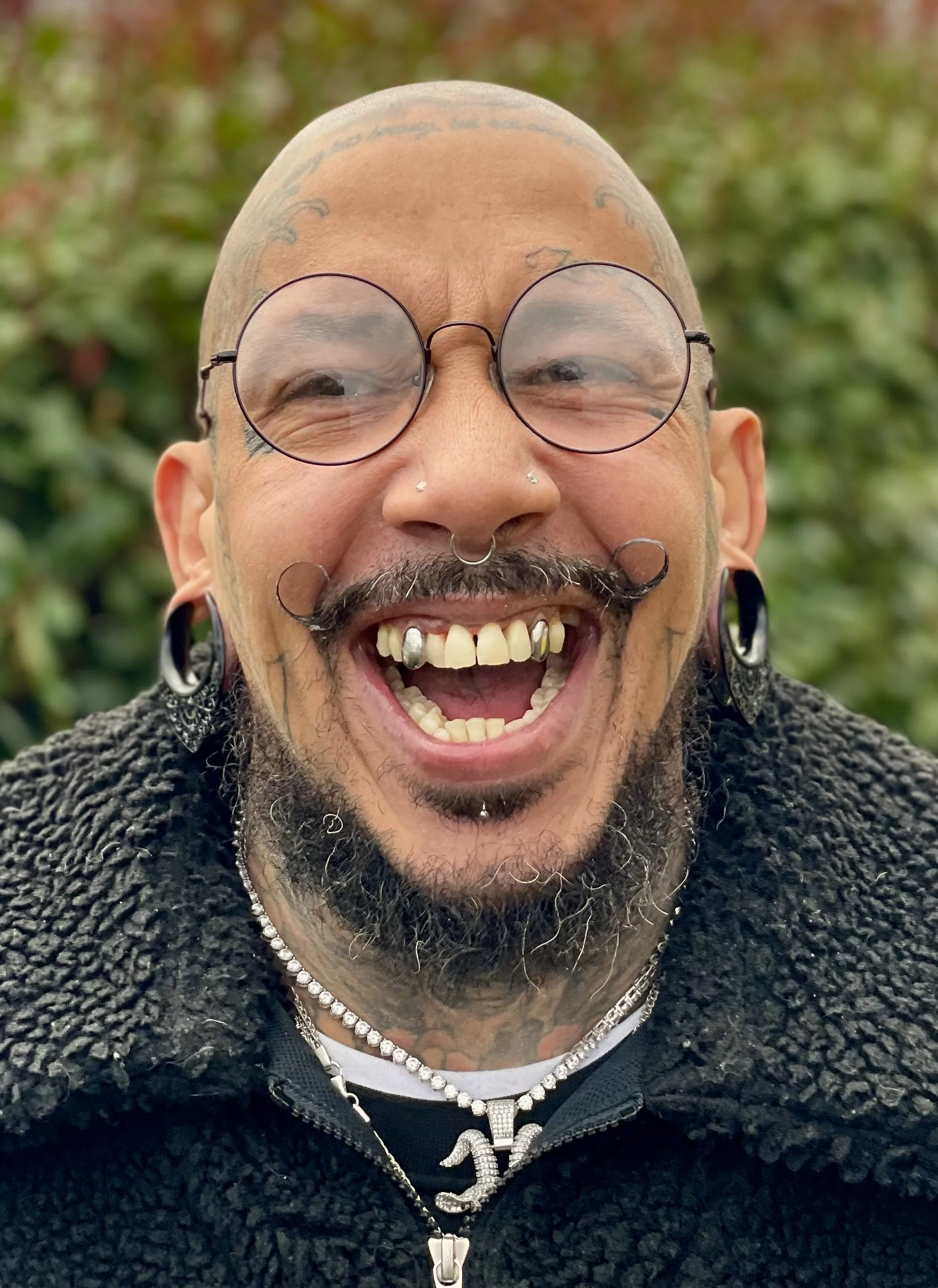Black man tattoo laughter.jpeg