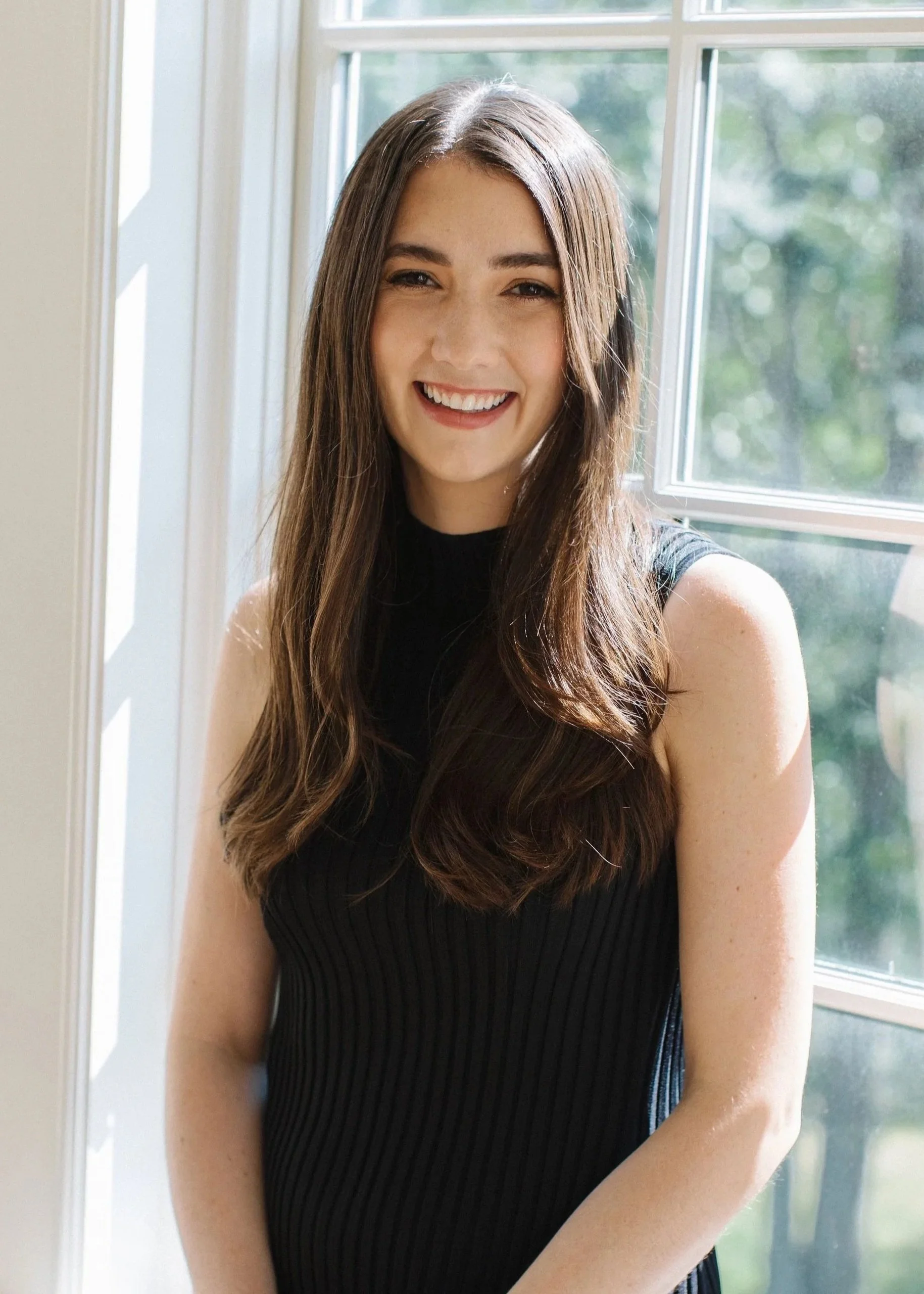 Hillman headshot smiling.jpg