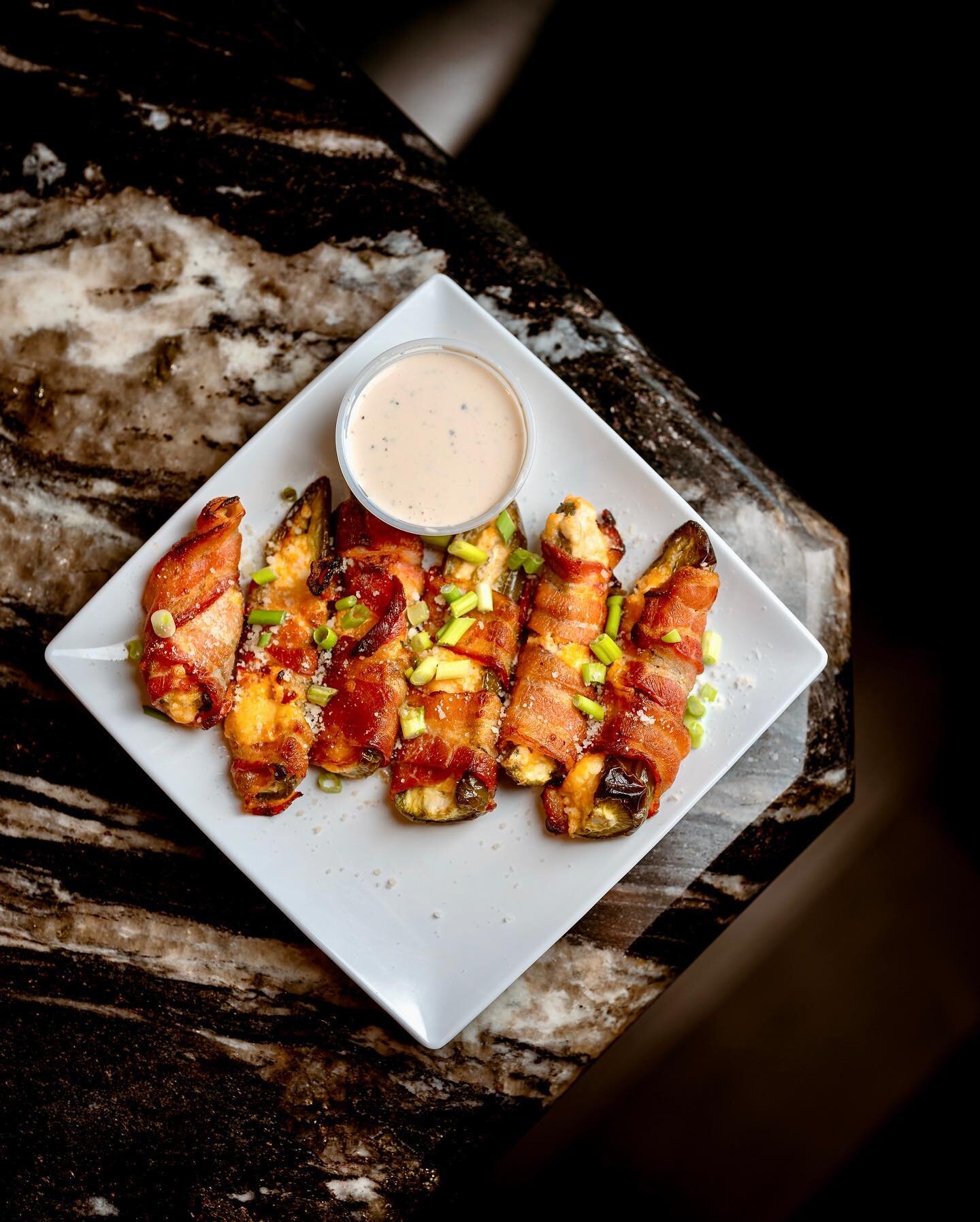 This is a perfect snack option after enjoying some Spicy Tequila Gimlets.

Bacon Wrapped Jalapeno Poppers:
Fresh (not frozen!) jalape&ntilde;o poppers stuffed with a savory blend of cream cheese and cheddar, wrapped with bacon and baked to perfection