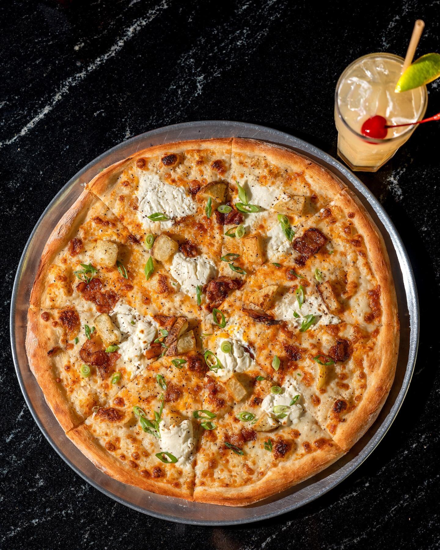 Come take shelter from the rain with us, we have the pizza and cocktails you need!

The Very Baked Potato: (May POTM)
Ranch base with cheddar cheese, bacon, baked potato, sour cream, garlic, green onions and salt and pepper.