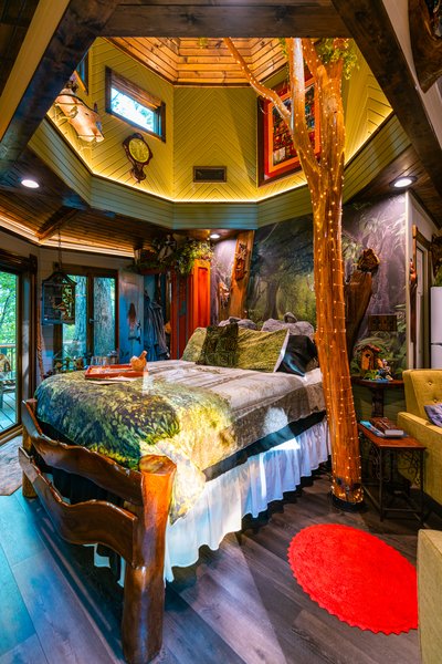 luxury bed clearstory fairy lights Enchanted Forest Treehouse