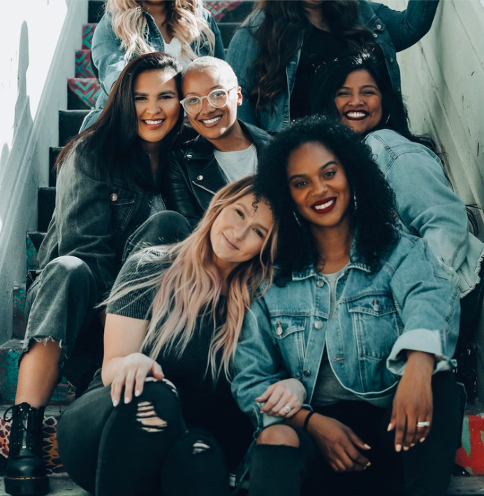 A group of women together, smiling