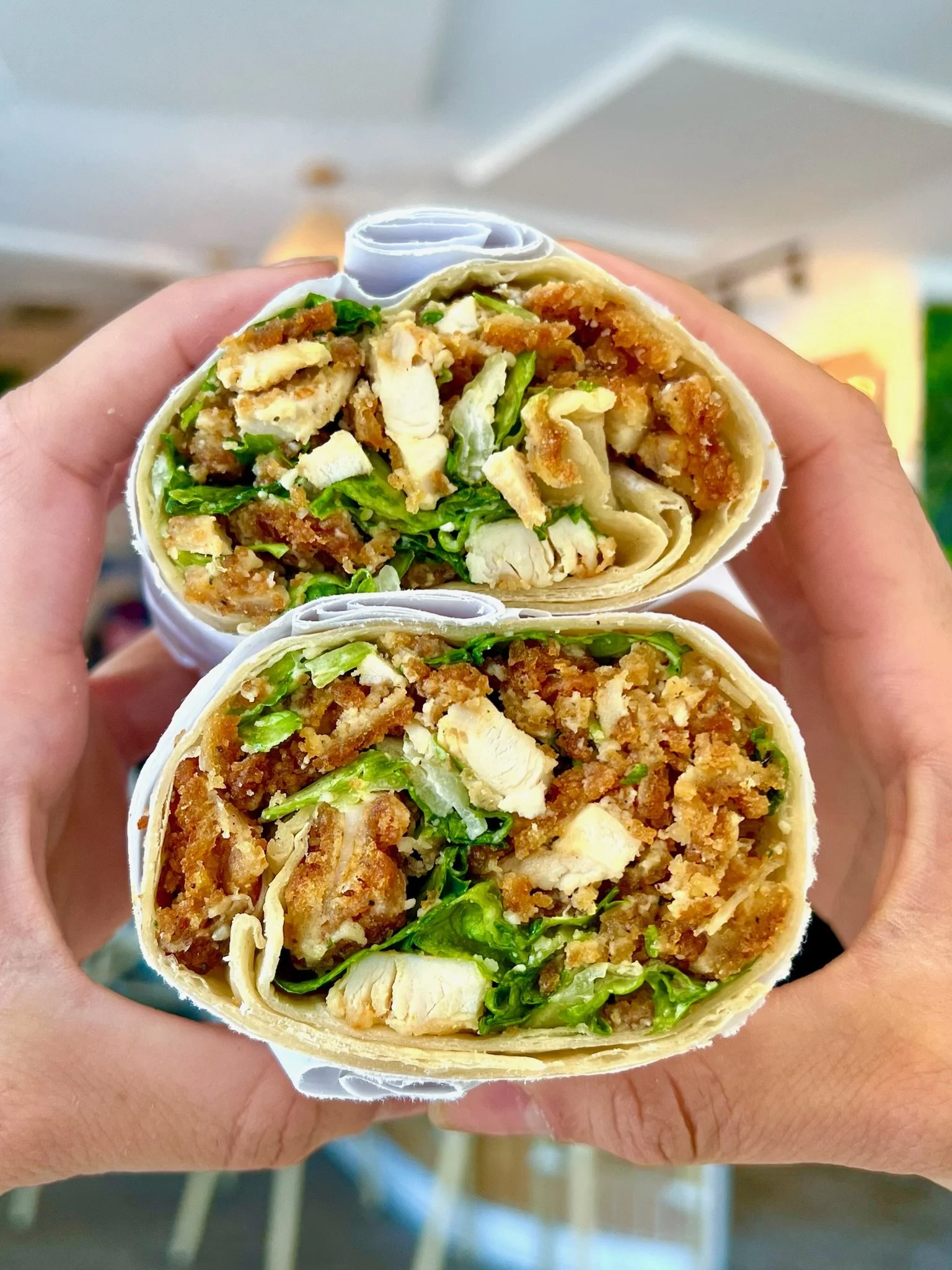 LAIS'S CAESAR WRAP chopped chicken cutlet, chopped romaine, parmesan crisps, caesar dressing in a white or wheat wrap