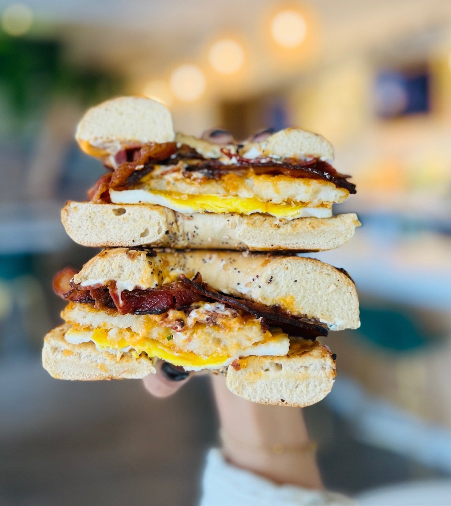 WAKE N' BACON SANDWICH | fried egg, applewood bacon, jalapeno cream cheese, hash brown, sriracha aioli