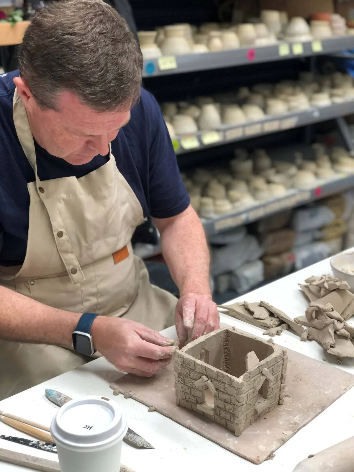 A close-up of a student hand-building a clay sculpture from scratch at Kingston Clay Studio, Melbourne's premier destination for ceramic art workshops.