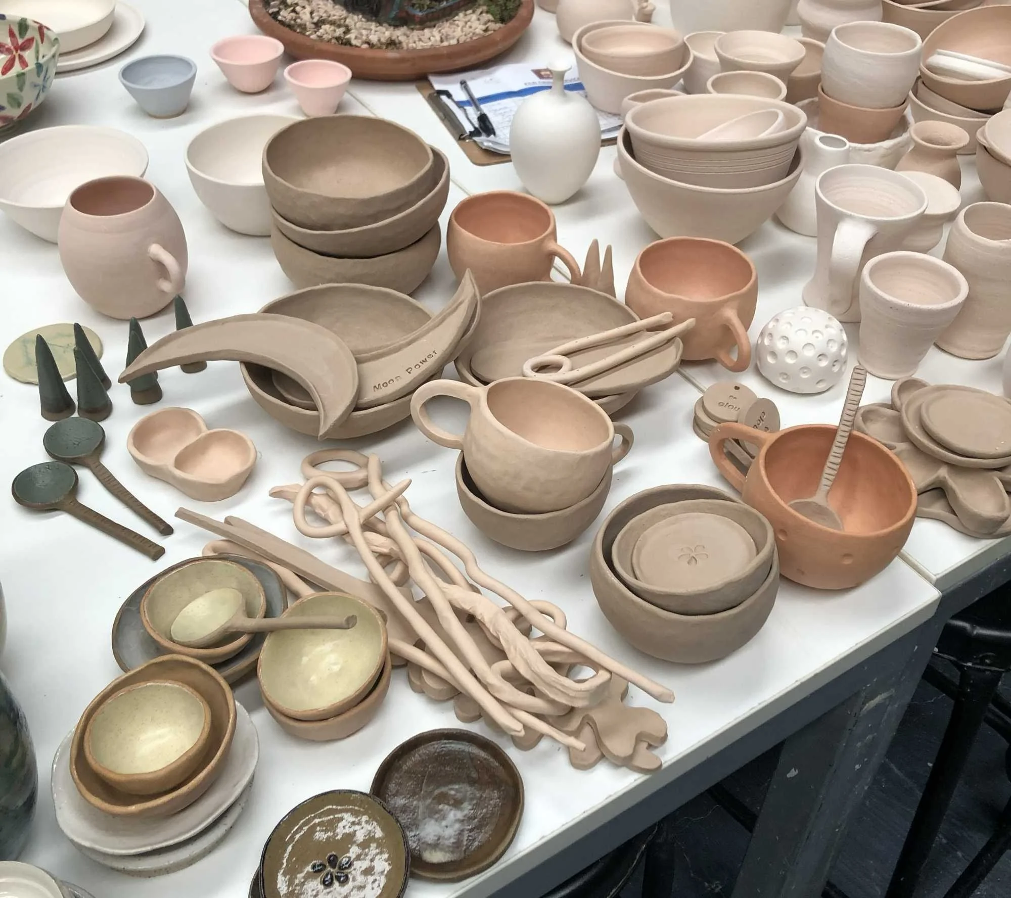 A calming display of handcrafted ceramic pots in our therapeutic studio, highlighting the sensory and creative benefits of pottery workshops for NDIS participants in Melbourne's Southeast.