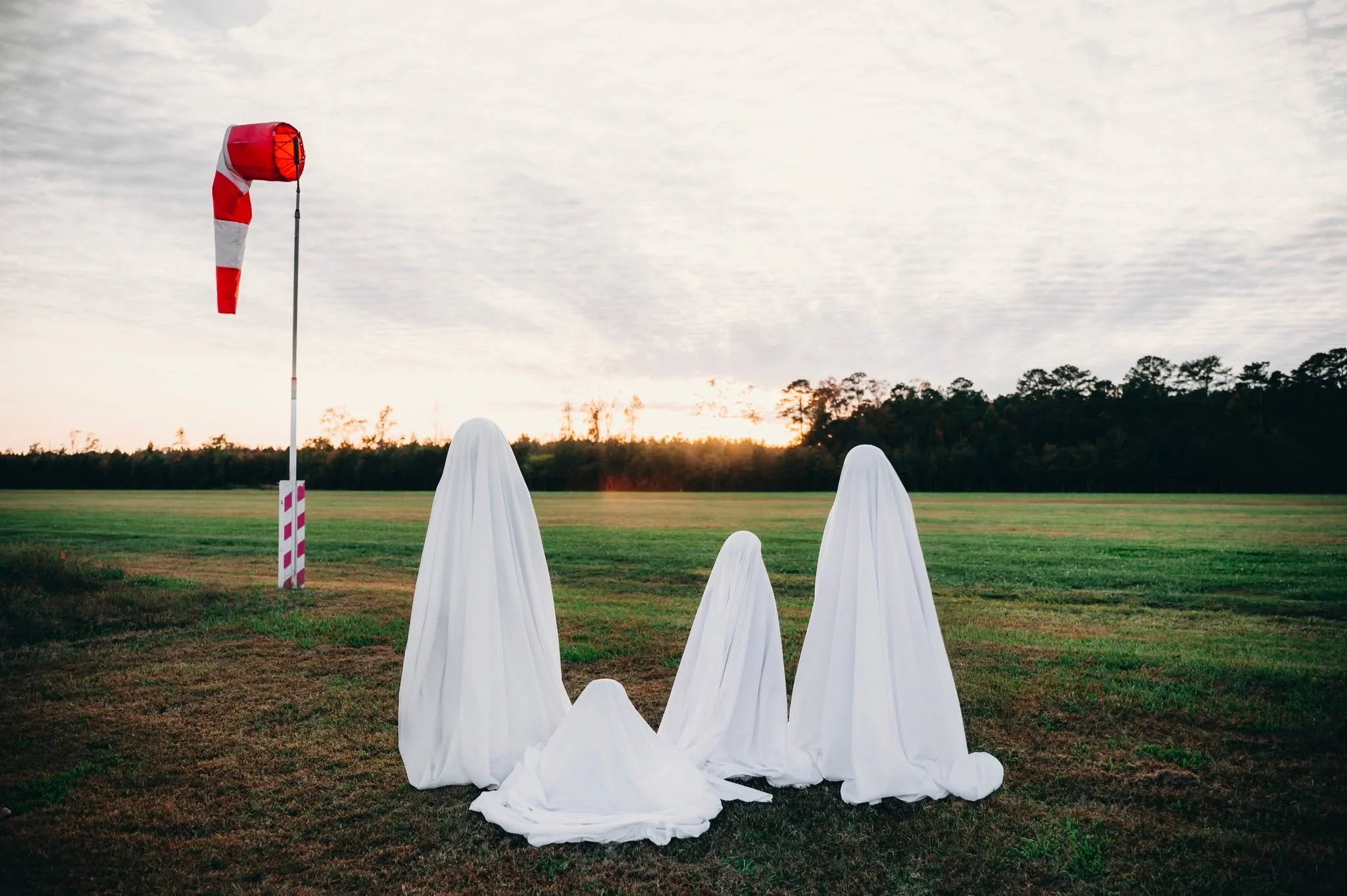 Every year they ask for something spooky, and every year it somehow turns into my favorite photo of them. Just a bunch of little ghosts chasing the last bit of golden light before bedtime.
