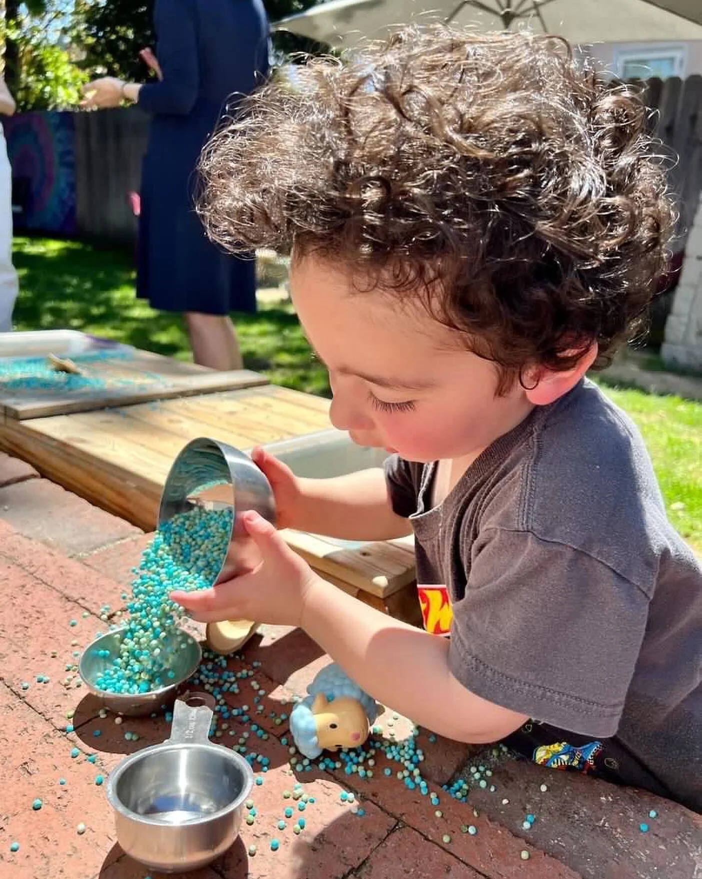 Pearl couscous was such a fun dry sensory bin filler! It felt amazing, was so fun to pour and scoop and made the best sounds as it was sprinkled over the metal toys. I dyed it exactly the same way I dye rice. This week I will be cooking it for a whol