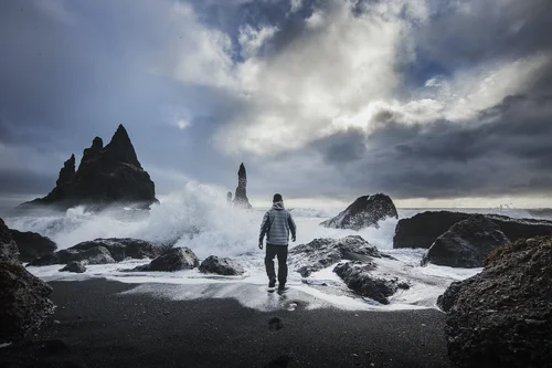 A man walking along a beach