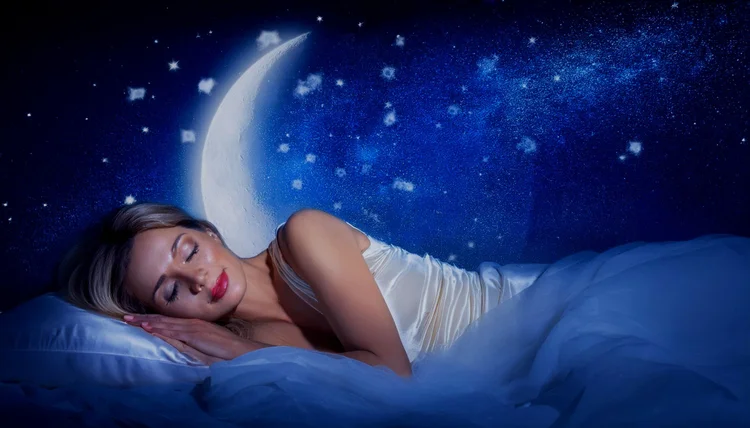 A woman asleep under a moonlit sky