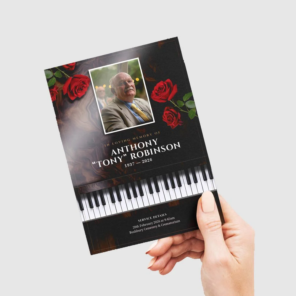 Funeral order of service  program with a picture of an elderly man, roses, and a piano keyboard design on a black background.