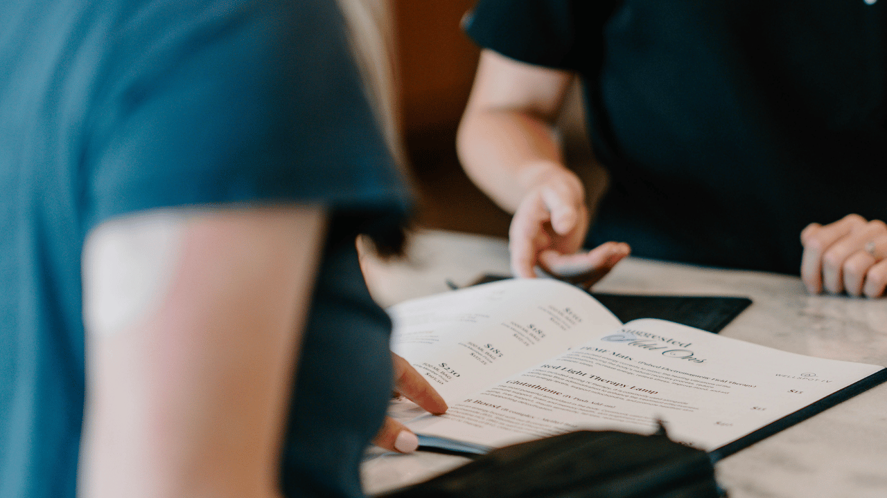 woman pointing to menu