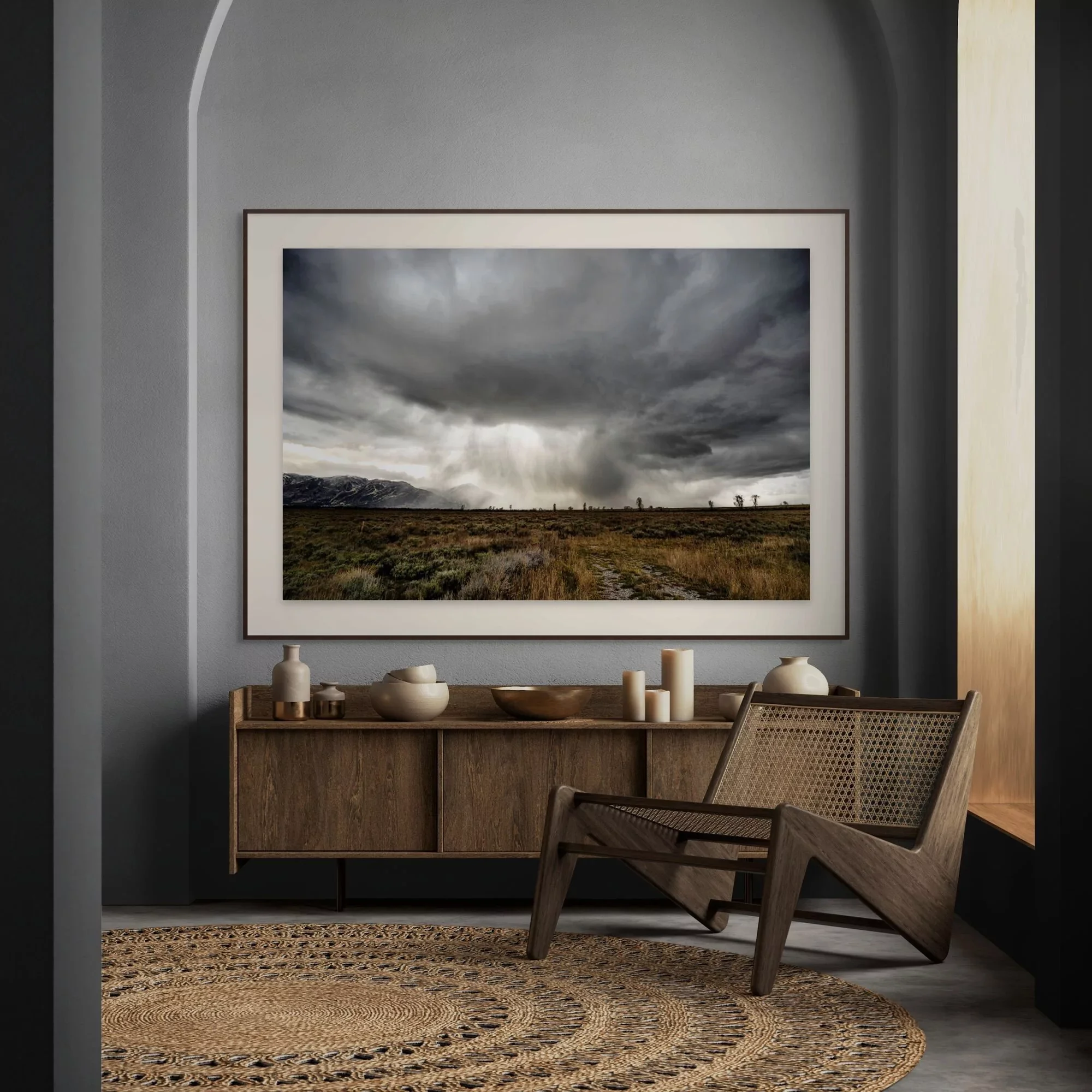 A fine art print in a room of a storm cloud of the grand tetons