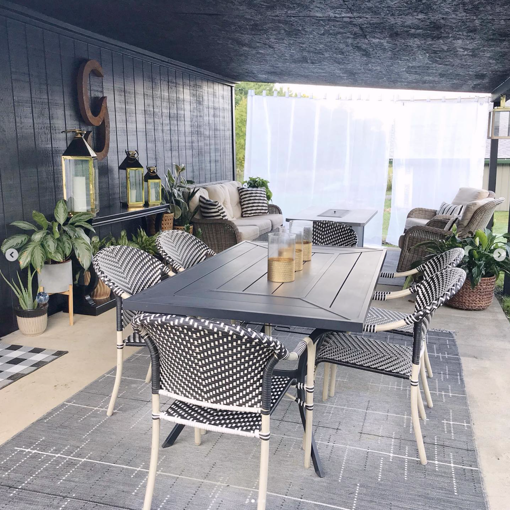The covered patio of a transformed former garage on the property,