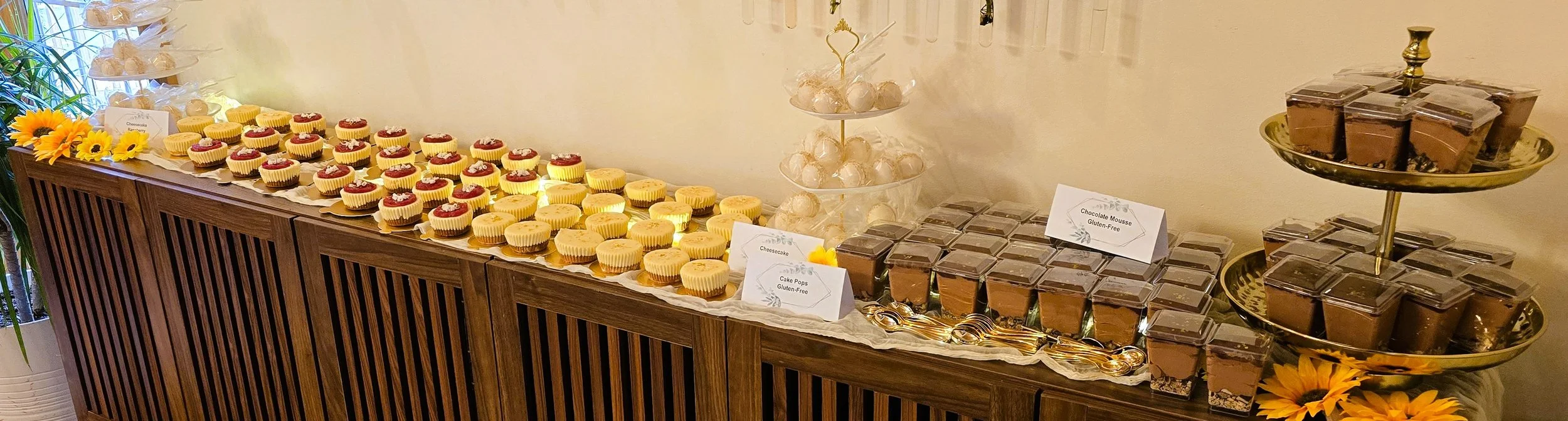 This dessert table for a New Year's wedding at Nomad's Distillery was a fully gluten-free collection of cake pops, cheesecakes, and parfait cups with chocolate mousse. They told us they were delicious and could not believe they were made gluten free.