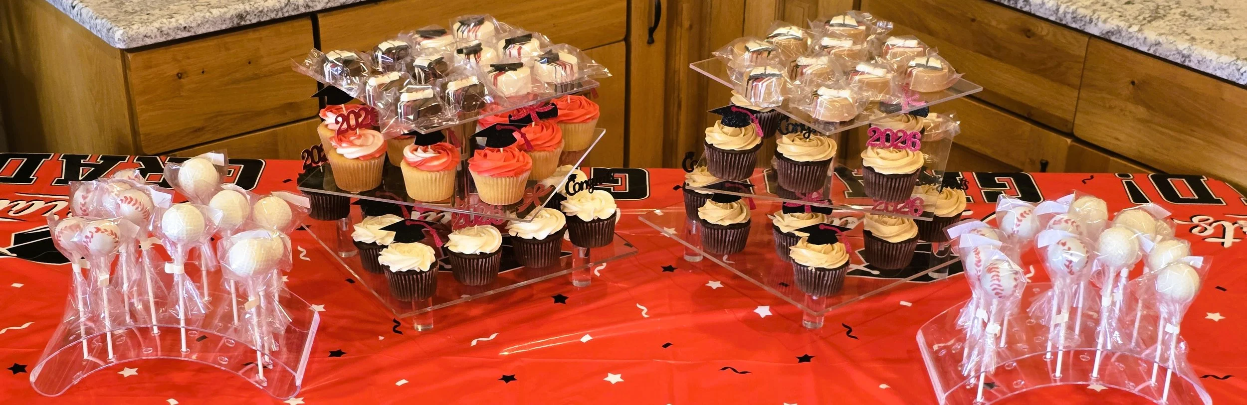 Graduation table cupcakes and cake pops.jpg