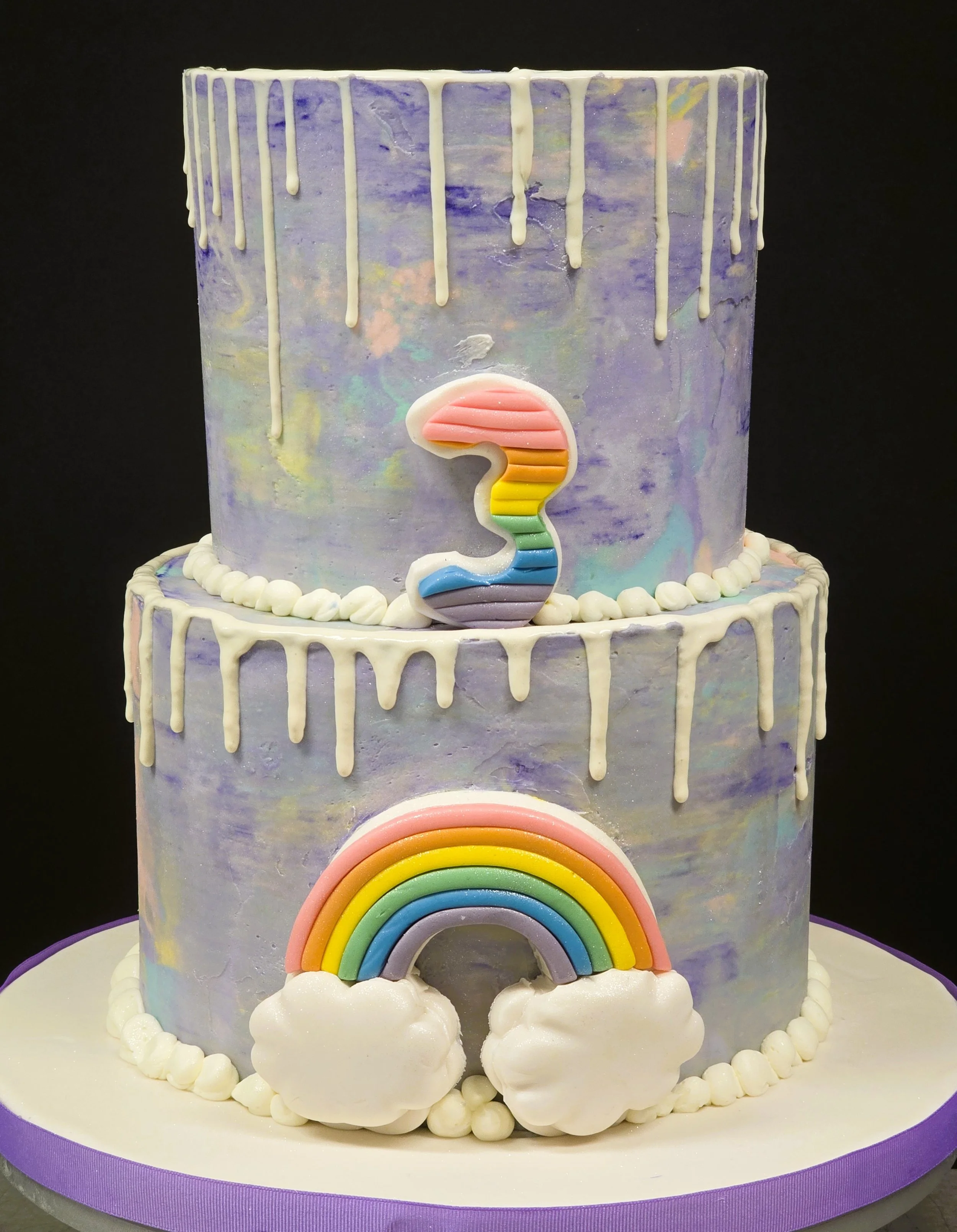 Birthday cake buttercream 3 year old Rainbow and clouds drip icing.jpg
