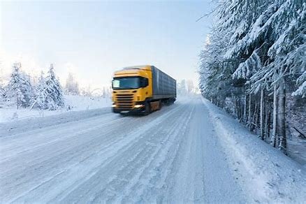 truck on snowy road.jpeg