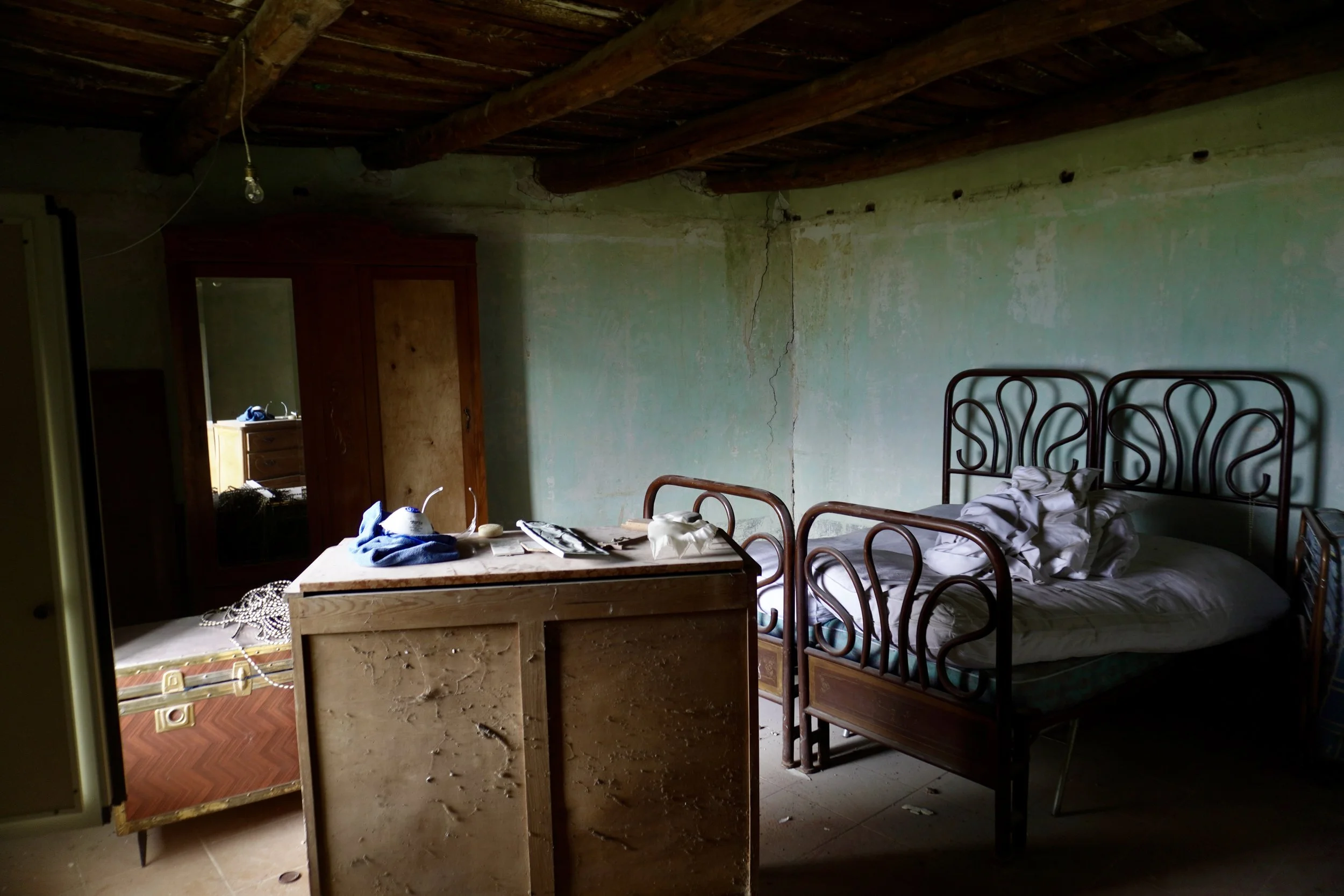 Historic bedroom inside Casa Bondi before renovation, southern Italy