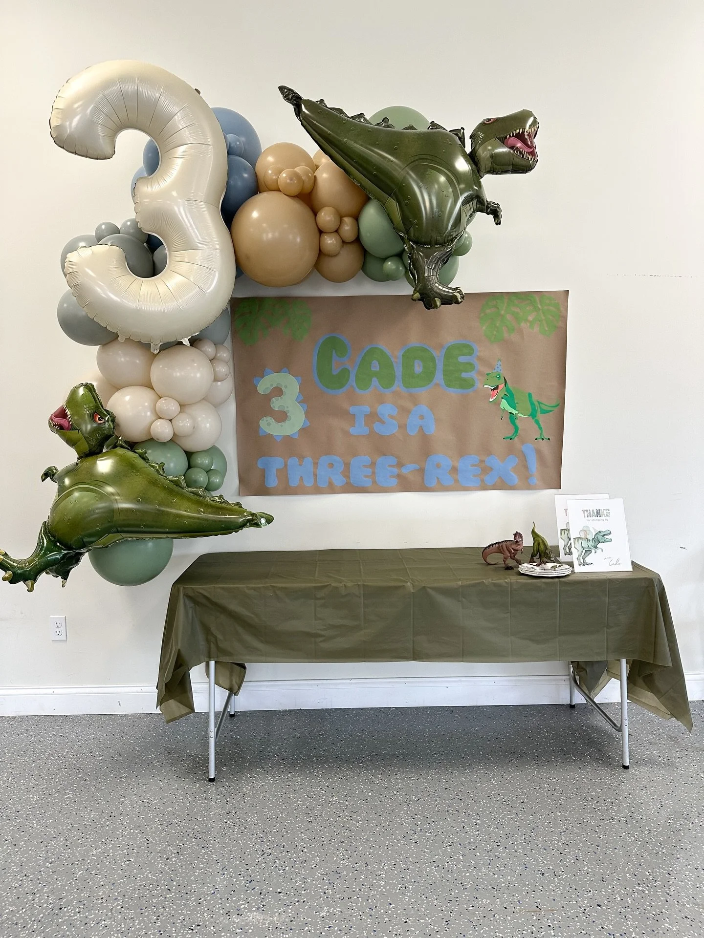 Balloons and a Custom Banner made the perfect dec-ROAR for this Three-Rex! 🦖