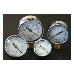 Four pressure gauges with white faces and black markings on a dark background.