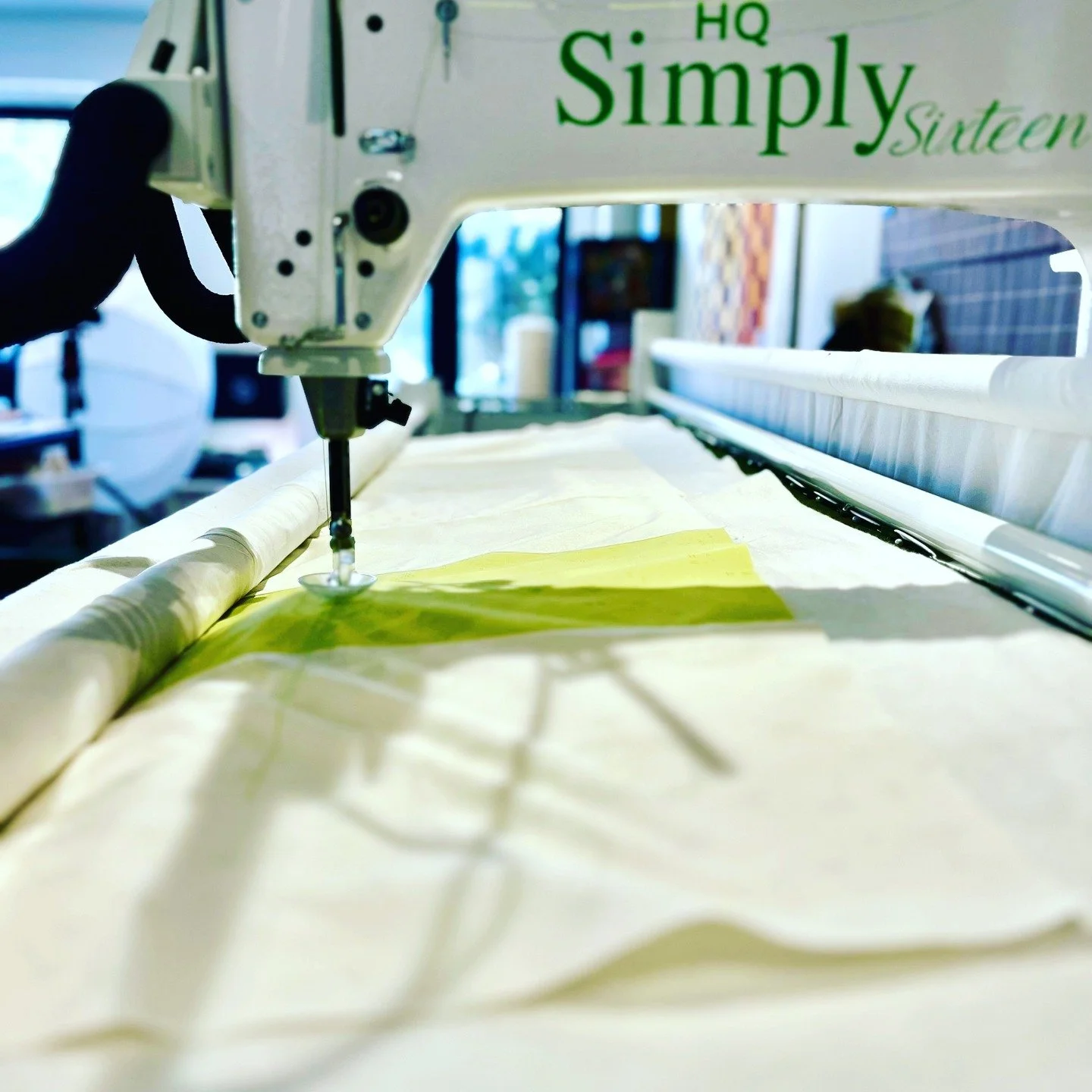 There is a new quilt on the on the long arm.
This one is for my bedroom. I have been making some really simple quilts that fit into the aesthetics of my home. I figure that fabric designers make so beautiful prints - why not just go simple and highli