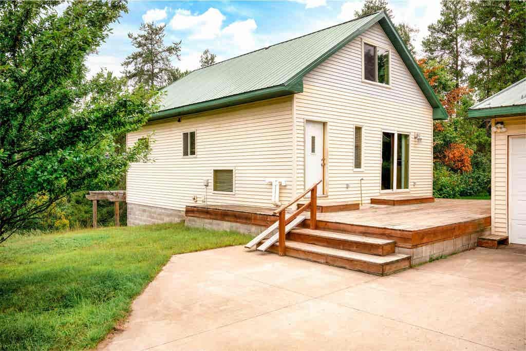 54755 Silverwolf. Tucked among the pines just outside Solon Springs, this beautifully crafted home combines the warmth of wood interiors with thoughtful modern comfort. The open main level features hardwood floors, vaulted ceilings, and abundant natu