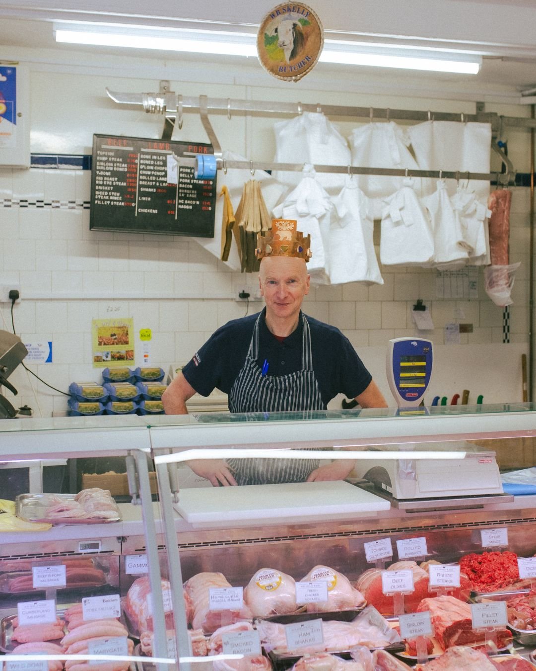 John Skelly—7th generation owner of W.R Skelly & Son Butchers—wearing a crown by Suzanne Wright.