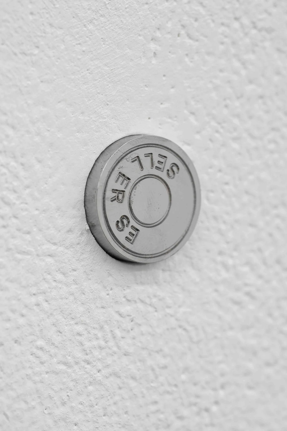  Tanja Widmann Johannes Porsch Produced by,  -1, One plus (Derivates) , 2025, Ø 2.4 x 1.5 cm, installation view at Cell Project Space, London, UK. Courtesy Cell Project Space, Photo: Damian Griffiths 