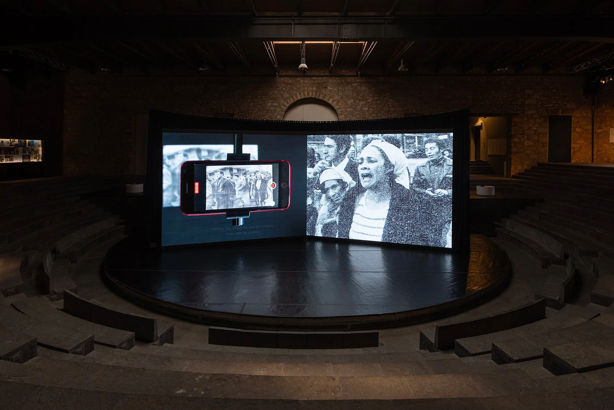  Bouchra Khalili ,   The Circle , 2023. Dual synchronized channel video installation. Video and 16mm film transferred to video. Colour and B/W, sound, 56 min. Installation view,  Space of Togetherness , Drama School of the National Theatre of Greece,