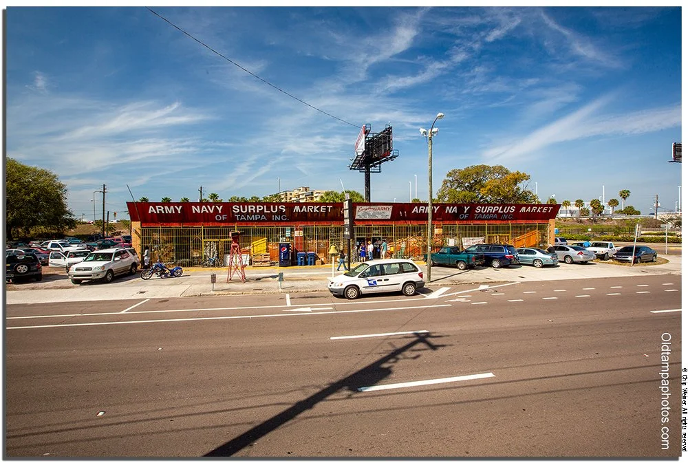 Tampa Army-Navy Surplus store Tampa exterior with bomb display and siren tower