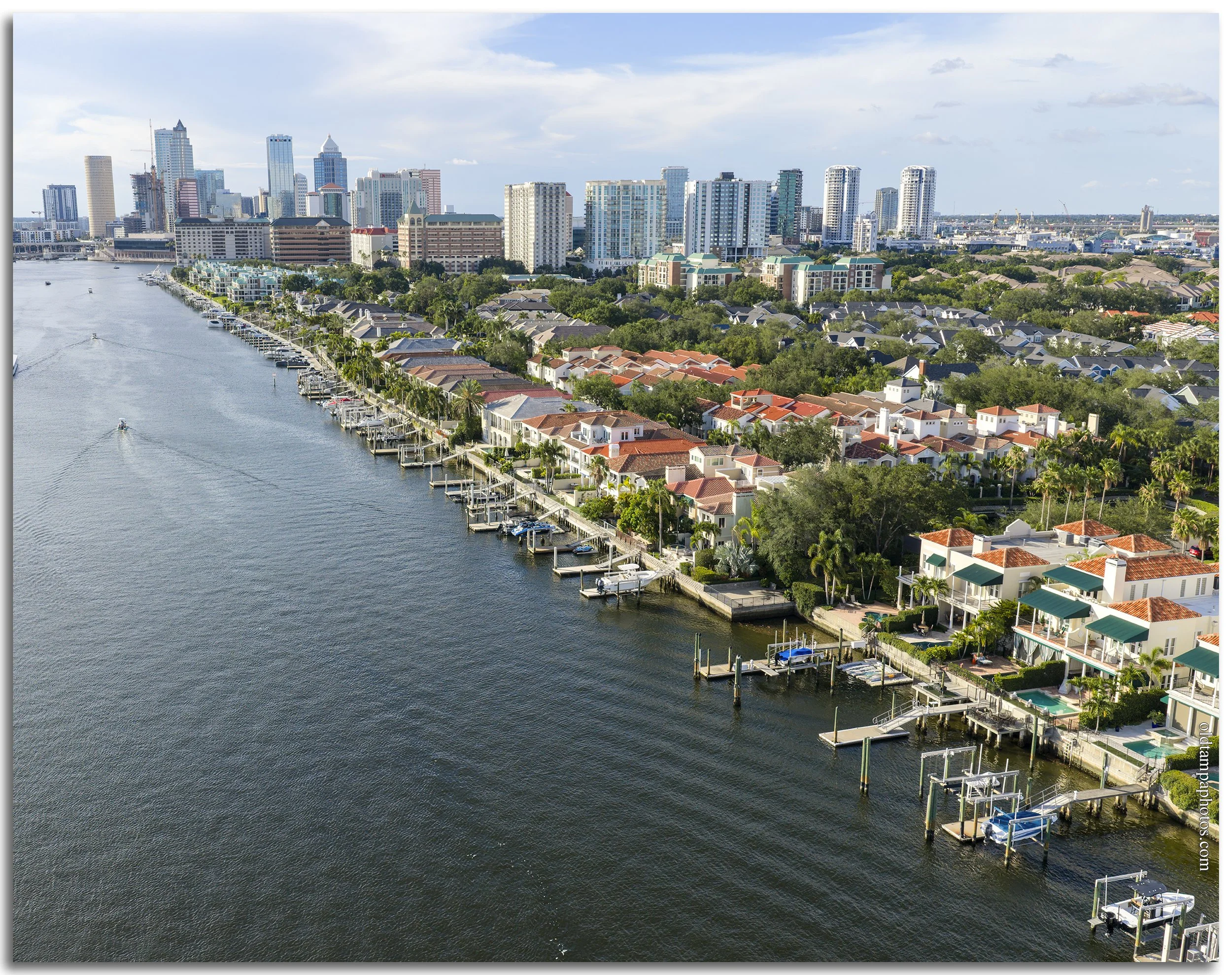 Aerial photograph of Harbor Island looking south in 2026, showcasing Tampa's waterfront skyline, residential towers, marinas, and the transformation of the former Seddon Island industrial port.