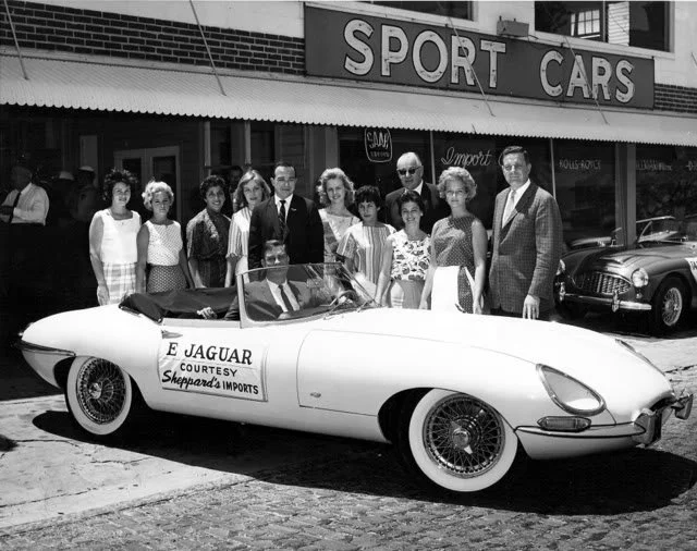 This photo was taken in front of the dealership on S. Howard Ave. The big event was the unveiling of the first Jaguar XK E delivered to the Southeast. Again, another example of Jack SR’s marketing skills. His promotional work started during his  Groc