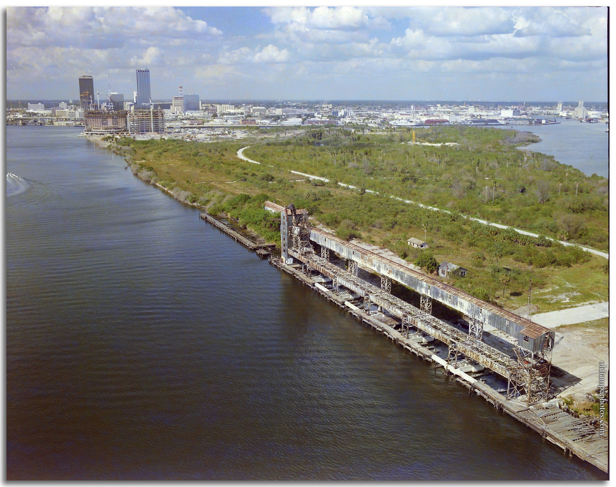 Historic photo of the phosphate elevators on Harbor Island in Tampa during the mid-1980s. The image captures the final years of Tampa's industrial waterfront before Harbor Island's transformation into a residential and commercial community.