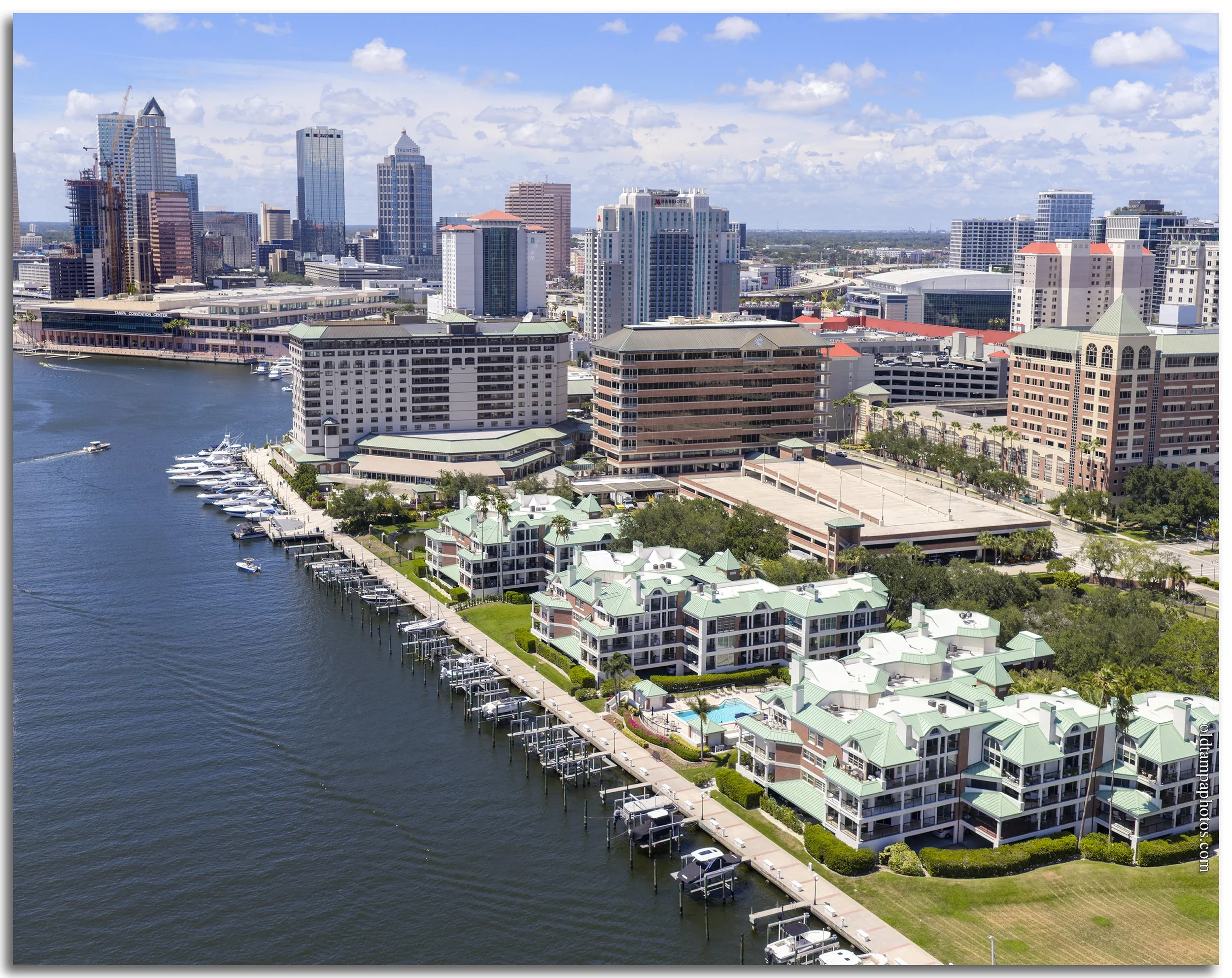 Aerial photograph of the north tip of Harbor Island and downtown Tampa in 2026, highlighting the city's waterfront skyline and the transformation of a former industrial port into a thriving urban neighborhood.